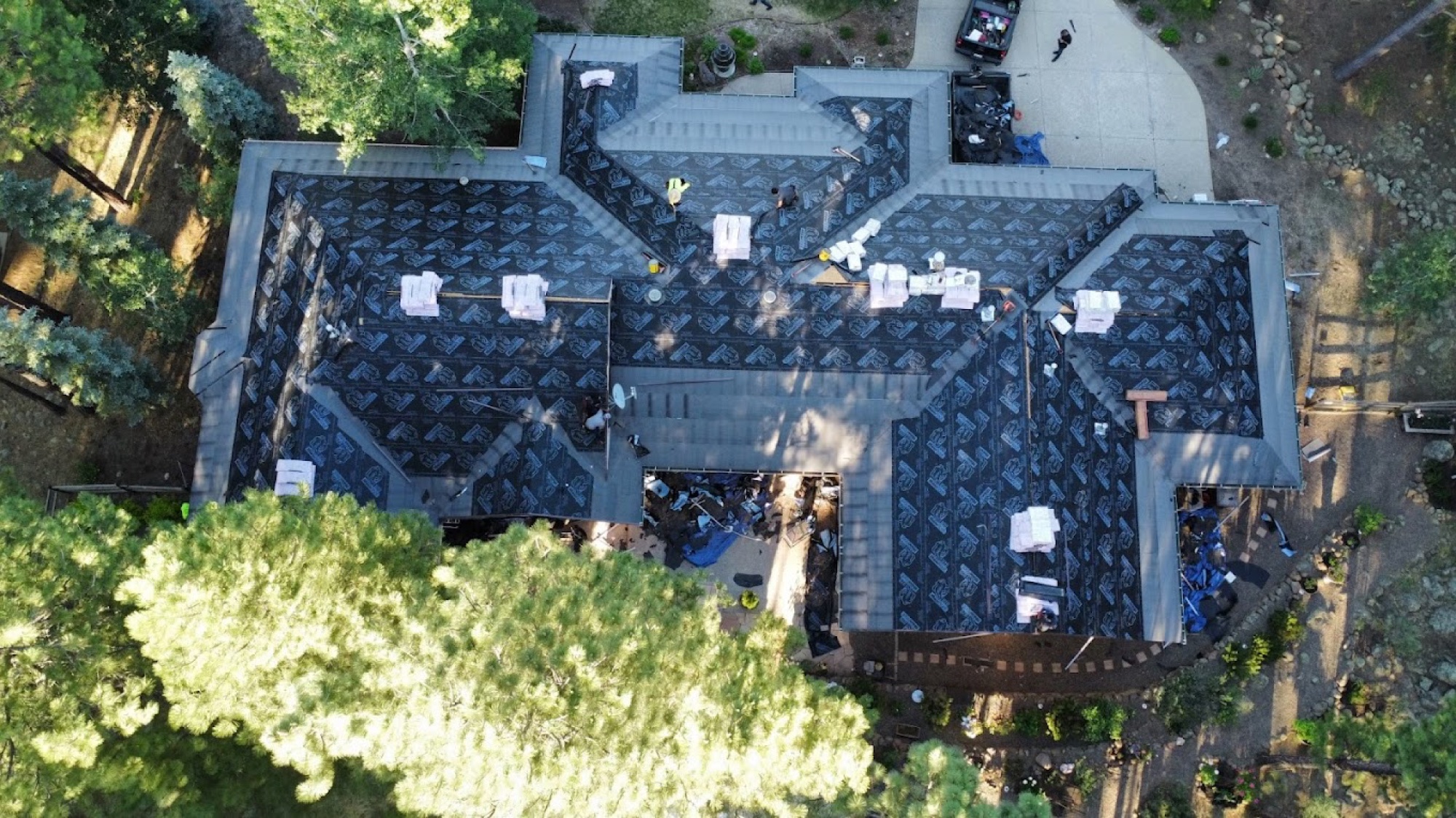 Aerial view of a complete roofing system installation