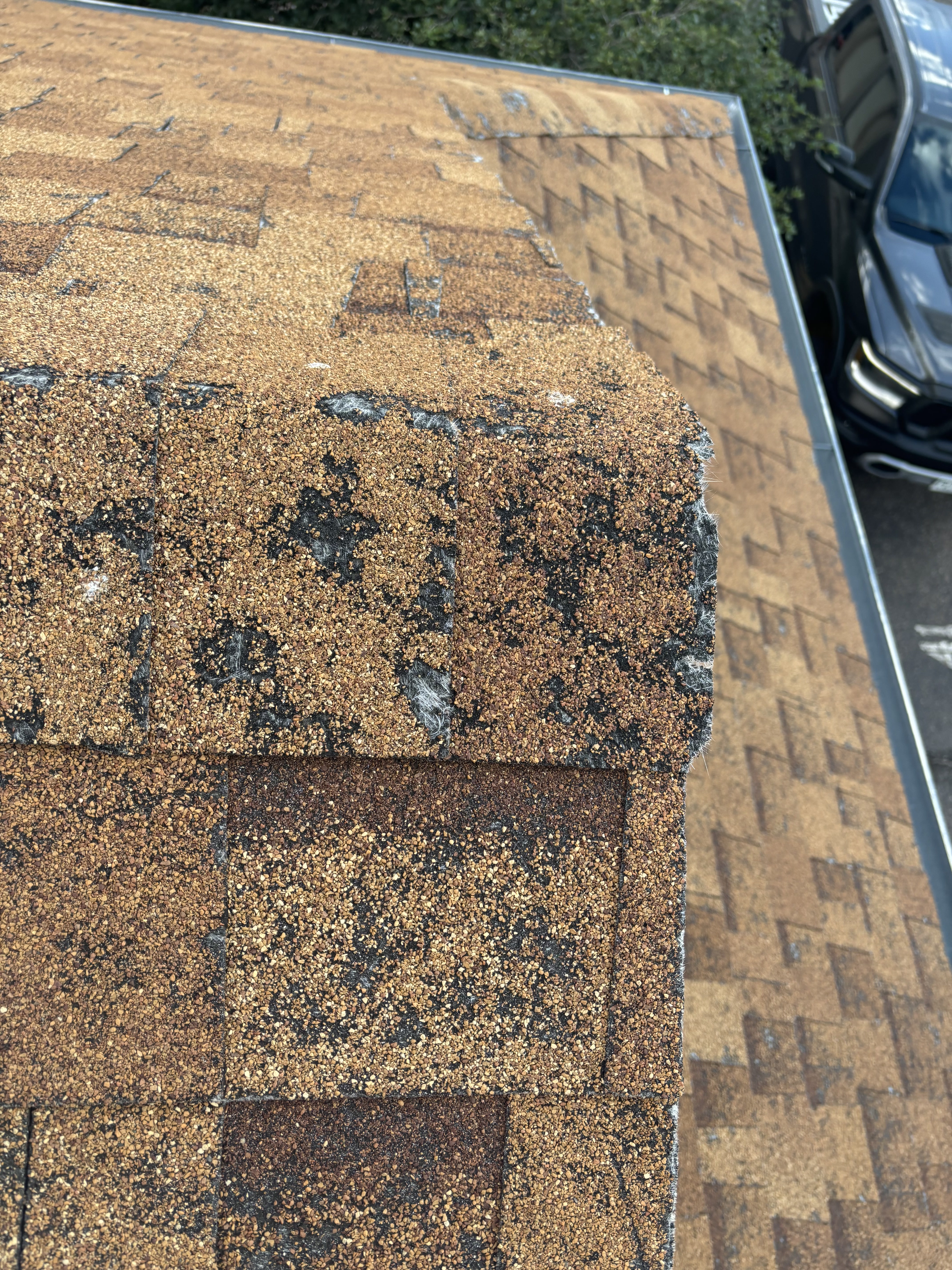Aerial view of hail damage across a shingle roof